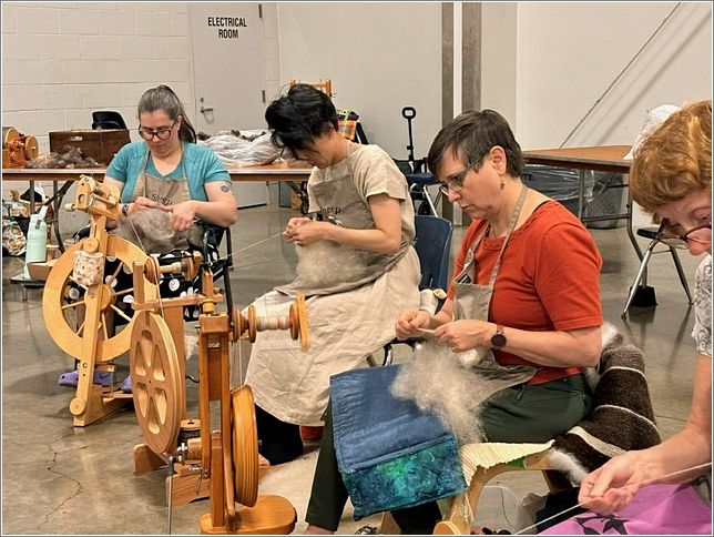 Spinners from left  Kate Perry, Mayumi Warkel, Margo Haywood and Rosalie Linse. Photo: Aurora Colony Handspinners Guild.